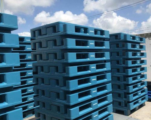 Hybrid wooden pallets made from a combination of wood and plastic materials for enhanced strength and durability.